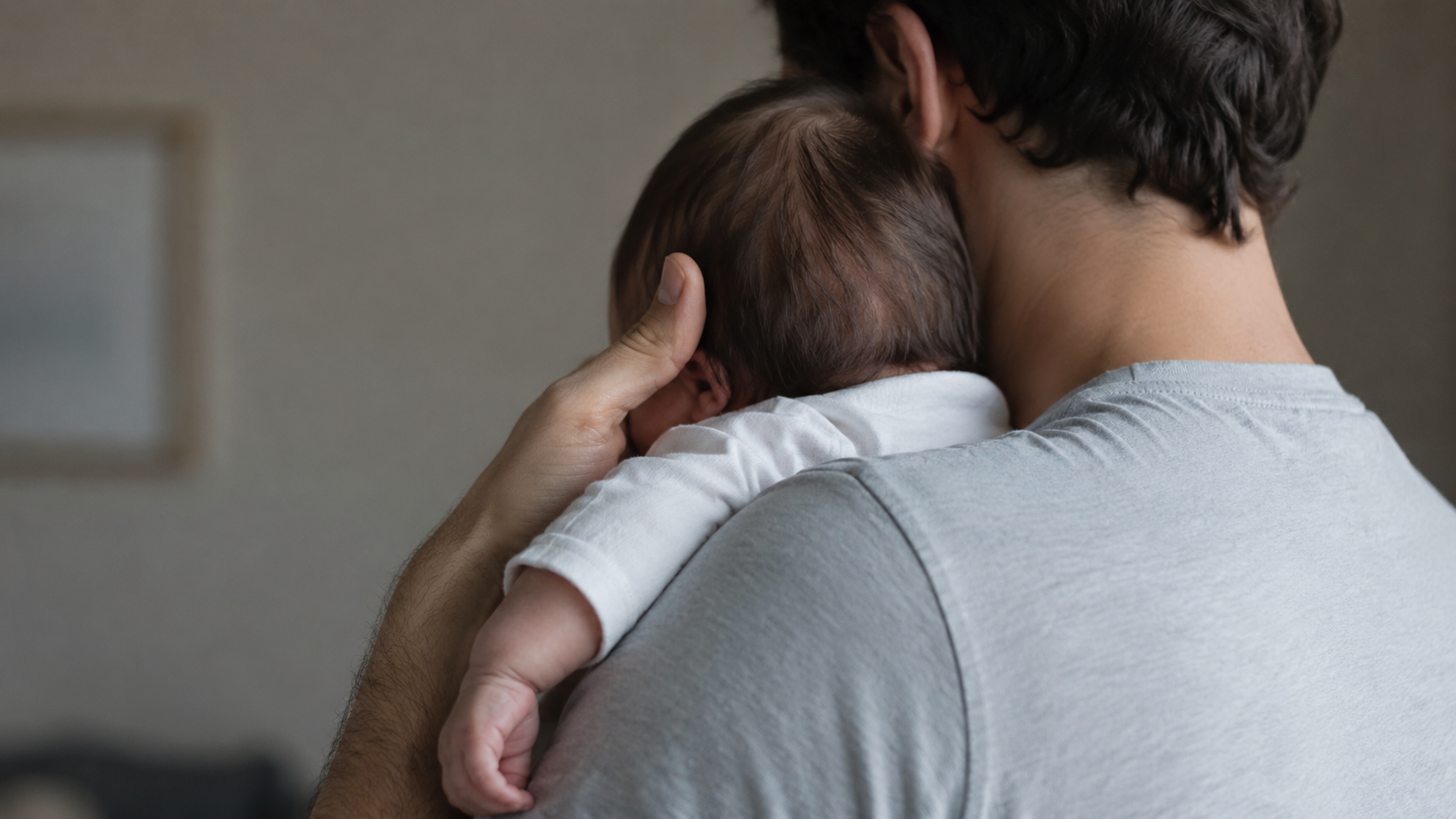 A father holding his newborn